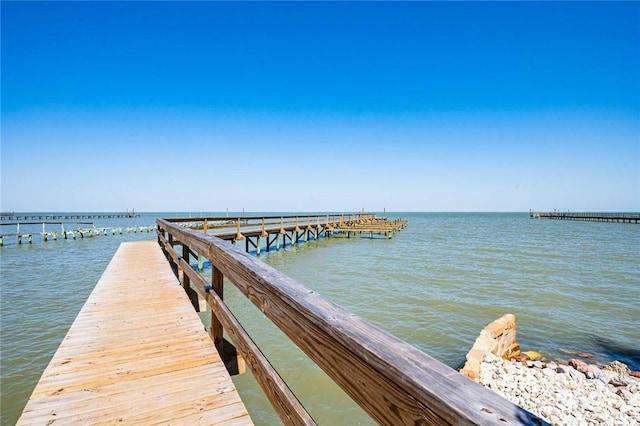 dock area featuring a water view