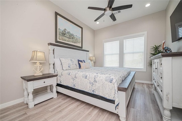 bedroom with light wood-type flooring and ceiling fan