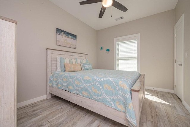 bedroom with ceiling fan and light hardwood / wood-style floors