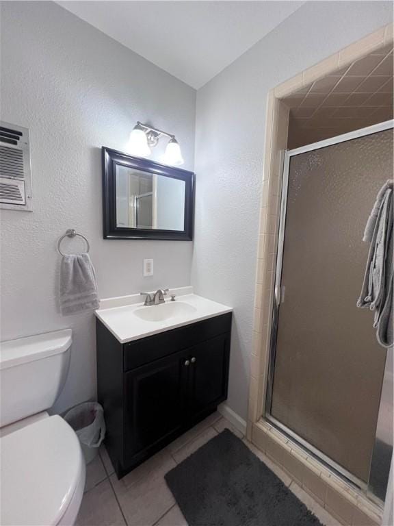 5825 San Saba Dr, Corpus Christi, TX 78407 - full bath with vanity, tile patterned floors, and a shower stall