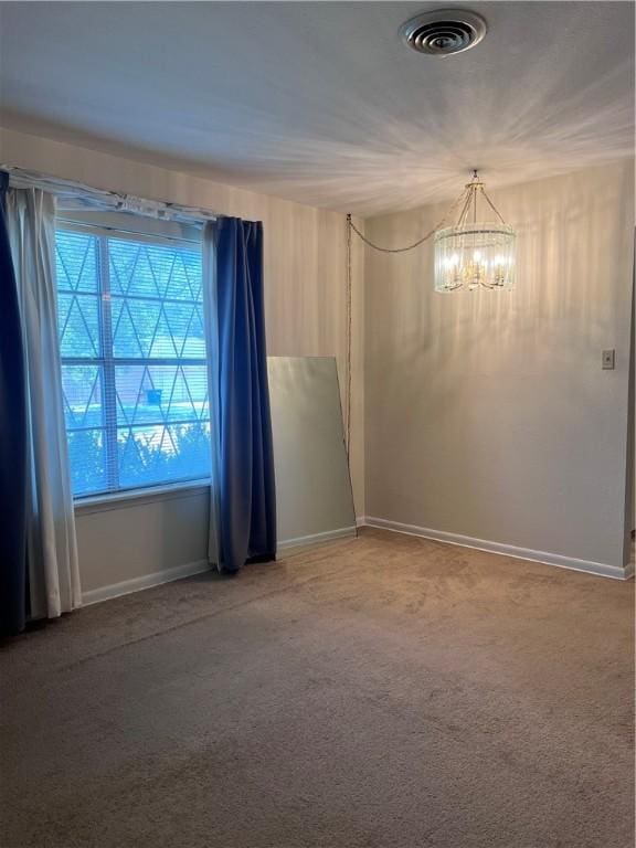 5825 San Saba Dr, Corpus Christi, TX 78407 - empty room featuring a chandelier and light colored carpet