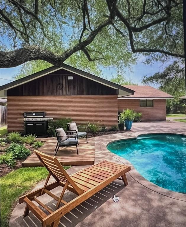 5825 San Saba Dr, Corpus Christi, TX 78407 - swimming pool featuring a patio and area for grilling