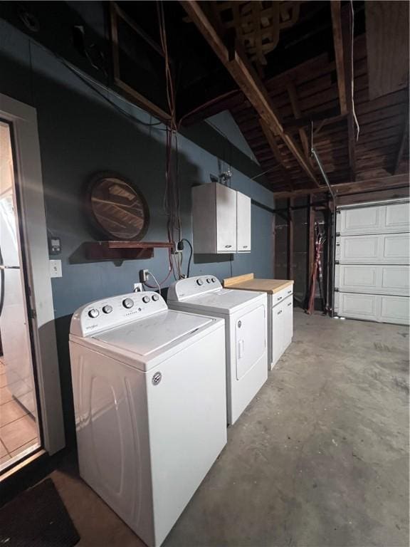 5825 San Saba Dr, Corpus Christi, TX 78407 - laundry room with cabinet space, washing machine and dryer, and a garage