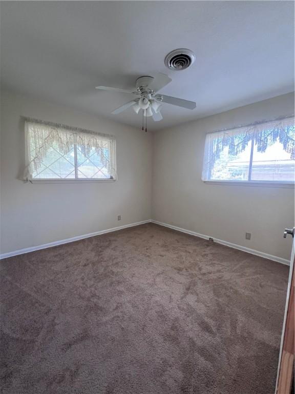 5825 San Saba Dr, Corpus Christi, TX 78407 - spare room with a ceiling fan and carpet