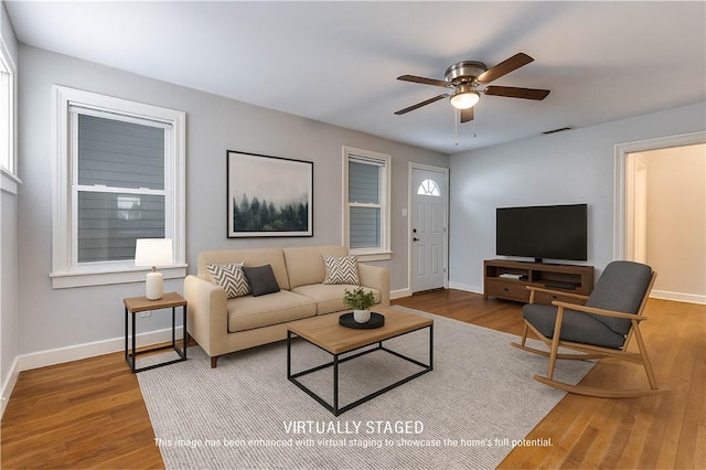 150 E Southcross Blvd, San Antonio, TX 78214 - living room featuring ceiling fan, baseboards, and wood finished floors
