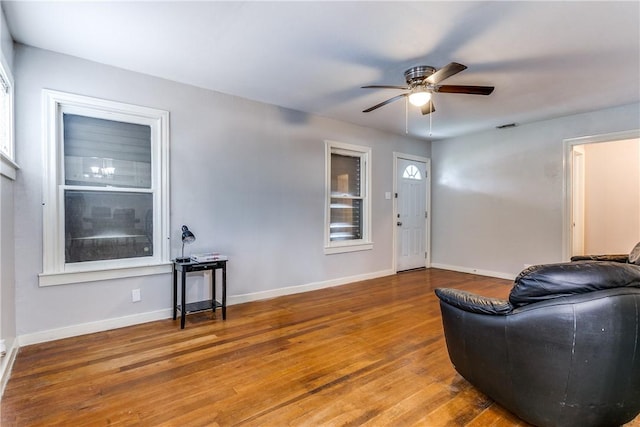 150 E Southcross Blvd, San Antonio, TX 78214 - living area with ceiling fan, wood finished floors, and baseboards