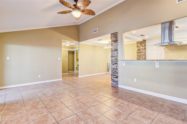 15317 Yardarm Ct, Corpus Christi, TX 78418 - unfurnished living room featuring lofted ceiling, ceiling fan, crown molding, and light tile patterned floors