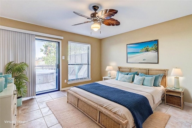 15317 Yardarm Ct, Corpus Christi, TX 78418 - bedroom featuring access to exterior, light tile patterned floors, and a ceiling fan