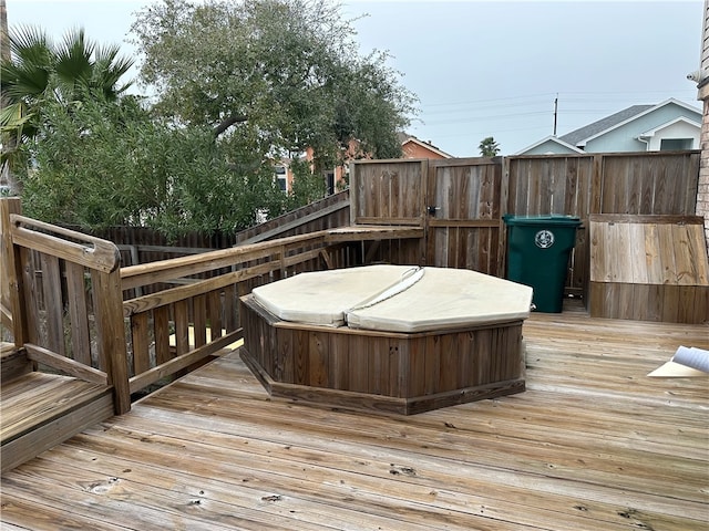 deck with a hot tub