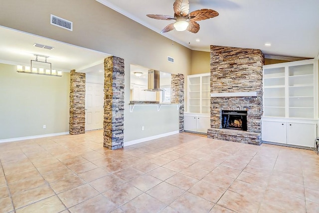 15317 Yardarm Ct, Corpus Christi, TX 78418 - unfurnished living room featuring a ceiling fan, vaulted ceiling, light tile patterned floors, crown molding, and a stone fireplace
