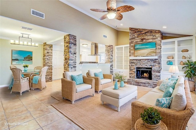 15317 Yardarm Ct, Corpus Christi, TX 78418 - living area featuring light tile patterned floors, ornamental molding, ceiling fan, a stone fireplace, and recessed lighting