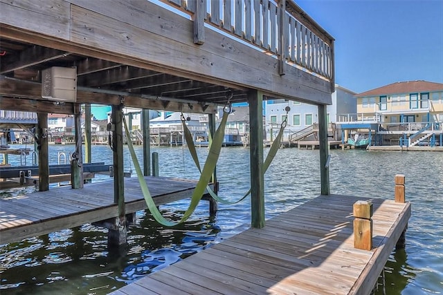 15317 Yardarm Ct, Corpus Christi, TX 78418 - dock featuring boat lift and a water view