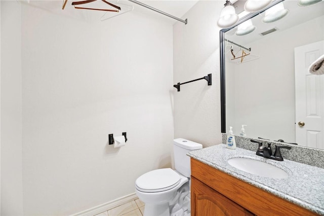 bathroom with visible vents, toilet, vanity, and tile patterned flooring