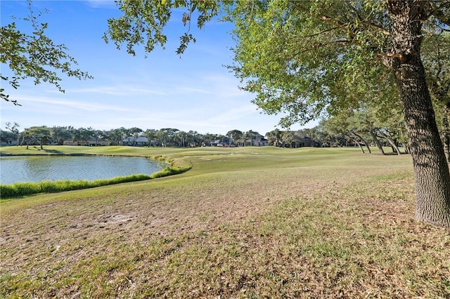 exterior space featuring a water view and view of golf course