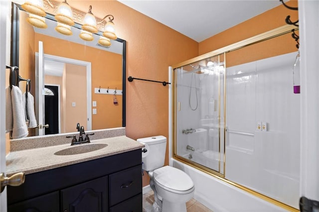 bathroom with enclosed tub / shower combo, toilet, and vanity