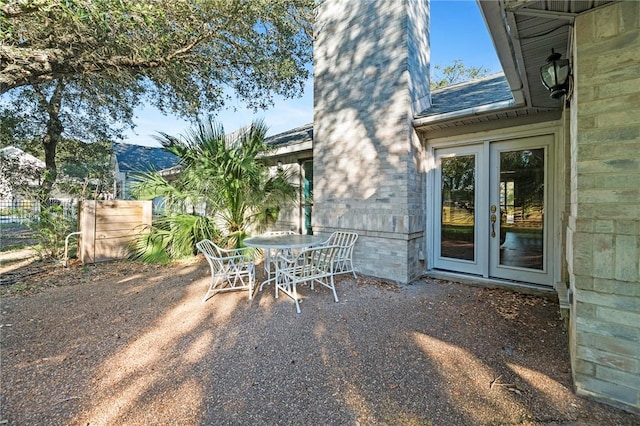 view of patio / terrace featuring outdoor dining area and fence