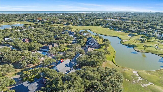 aerial view with golf course view and a water view