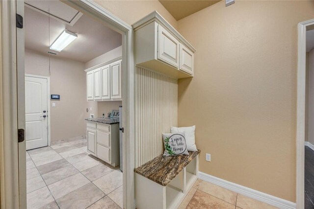 3722 Lake Hawkins Ct, Robstown, TX 78380 - laundry area with light tile patterned flooring, attic access, and baseboards