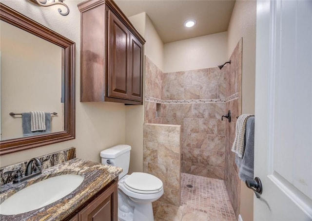 3722 Lake Hawkins Ct, Robstown, TX 78380 - bathroom featuring tiled shower, toilet, and vanity