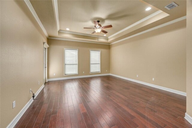 3722 Lake Hawkins Ct, Robstown, TX 78380 - empty room with a tray ceiling, a ceiling fan, dark wood finished floors, ornamental molding, and baseboards
