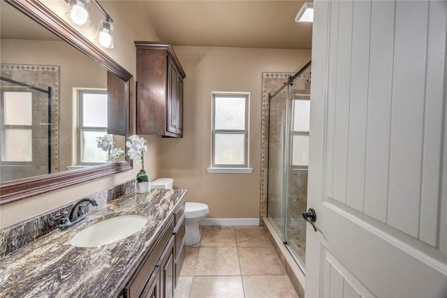 3722 Lake Hawkins Ct, Robstown, TX 78380 - full bathroom featuring a shower stall, vanity, plenty of natural light, and baseboards