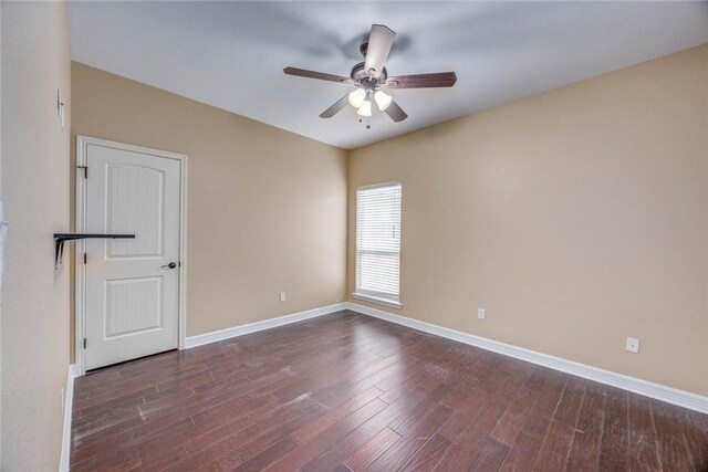 3722 Lake Hawkins Ct, Robstown, TX 78380 - spare room with a ceiling fan, dark wood-type flooring, and baseboards