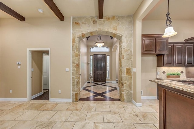 3722 Lake Hawkins Ct, Robstown, TX 78380 - entrance foyer with arched walkways, beamed ceiling, and baseboards