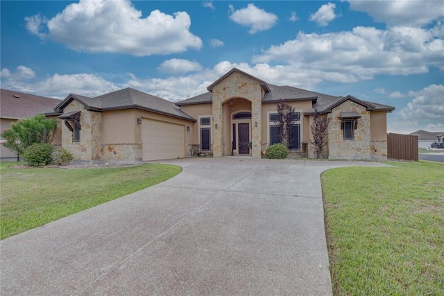3722 Lake Hawkins Ct, Robstown, TX 78380 - view of front of house featuring stone siding, concrete driveway, an attached garage, and a front yard