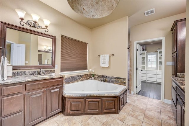 3722 Lake Hawkins Ct, Robstown, TX 78380 - full bath featuring a whirlpool tub and vanity