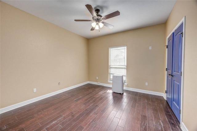 3722 Lake Hawkins Ct, Robstown, TX 78380 - empty room featuring a ceiling fan, dark wood finished floors, and baseboards