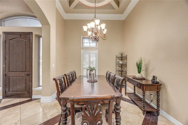 3722 Lake Hawkins Ct, Robstown, TX 78380 - dining area with light tile patterned flooring, arched walkways, a chandelier, crown molding, and baseboards