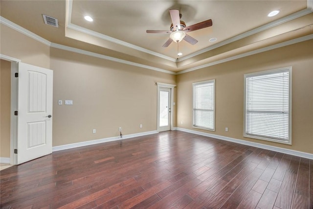 3722 Lake Hawkins Ct, Robstown, TX 78380 - spare room with a raised ceiling, a ceiling fan, dark wood-type flooring, crown molding, and baseboards