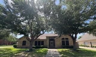 7502 Lourdes St, Corpus Christi, TX 78414 - ranch-style house featuring a front yard