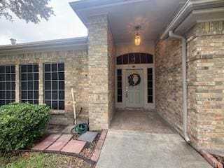 7502 Lourdes St, Corpus Christi, TX 78414 - view of exterior entry featuring brick siding
