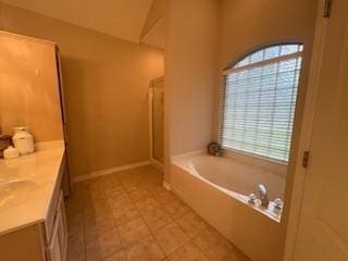 7502 Lourdes St, Corpus Christi, TX 78414 - bathroom featuring a bath, vanity, a shower, and tile patterned floors
