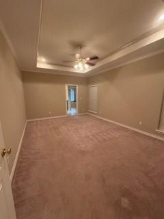 7502 Lourdes St, Corpus Christi, TX 78414 - carpeted empty room with a tray ceiling, ornamental molding, and ceiling fan