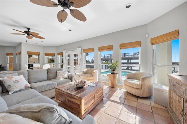 living area with light tile patterned floors, french doors, and a wealth of natural light