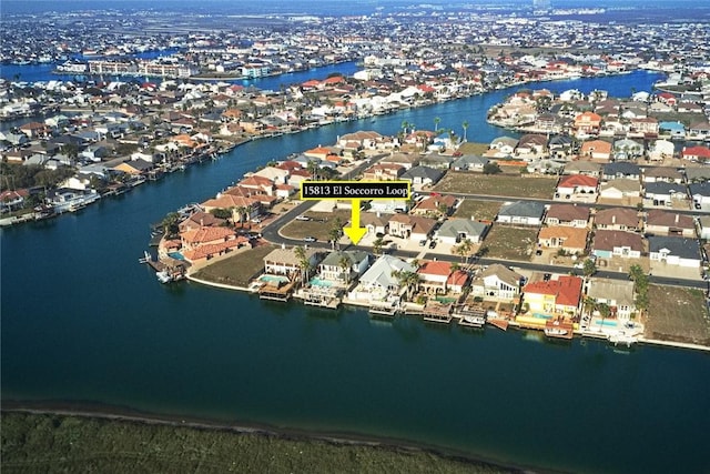 birds eye view of property featuring a residential view and a water view