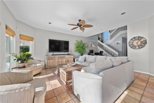 living room featuring recessed lighting, stairway, baseboards, and a ceiling fan