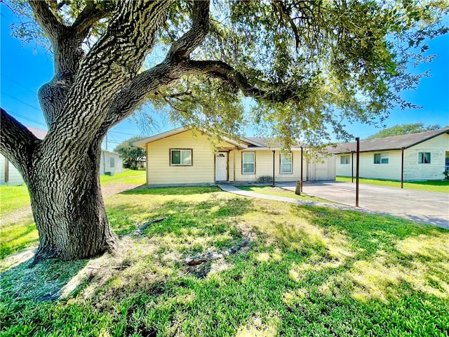 ranch-style house with a front lawn