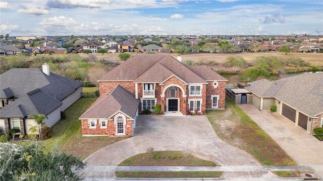 view of front property with a balcony and a garage