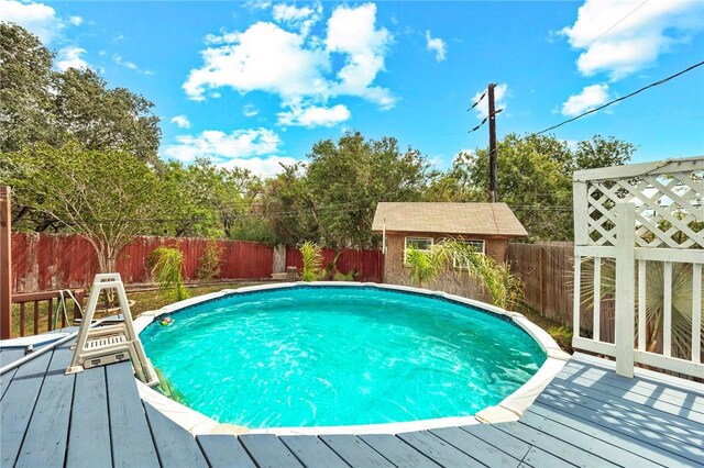 4026 Brownwood, Corpus Christi, TX 78410 - view of pool featuring a wooden deck and a fenced backyard