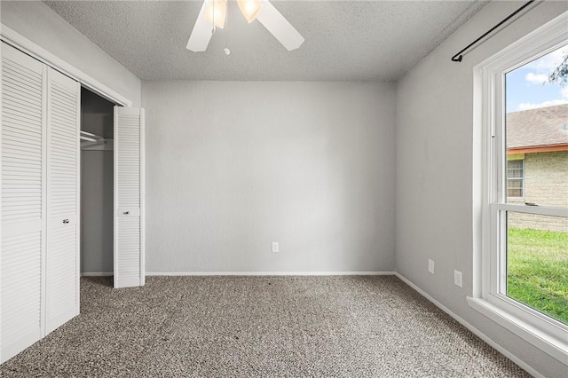4026 Brownwood, Corpus Christi, TX 78410 - unfurnished bedroom featuring carpet flooring, a textured ceiling, a closet, baseboards, and a ceiling fan