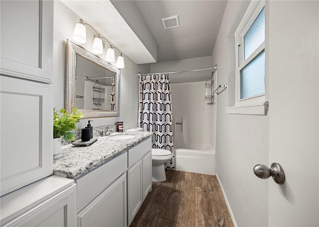 4026 Brownwood, Corpus Christi, TX 78410 - bathroom with wood finished floors, vanity, toilet, baseboards, and shower / bath combination with curtain