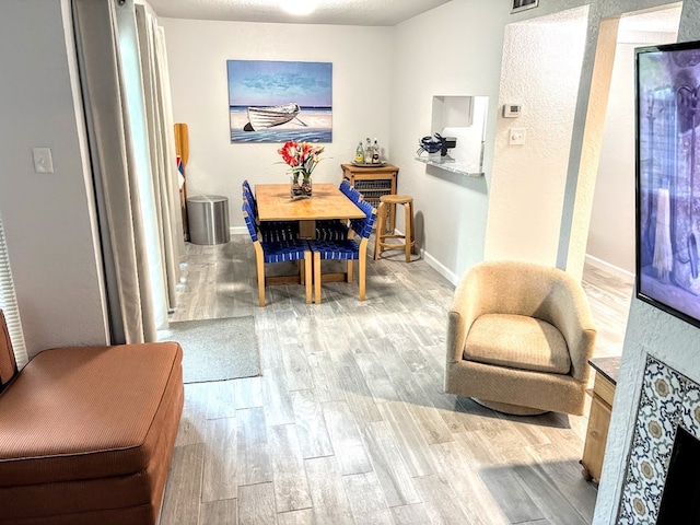 dining area with light hardwood / wood-style floors