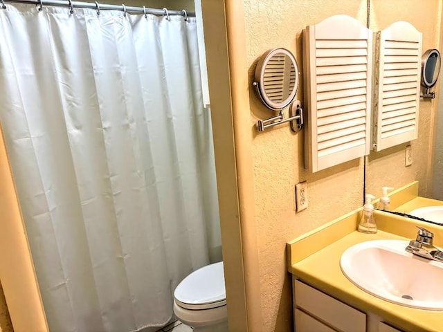 bathroom with toilet and sink