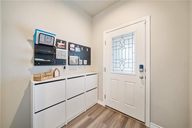 1142 Breebry Dr, Corpus Christi, TX 78415 - doorway to outside featuring light wood finished floors and baseboards