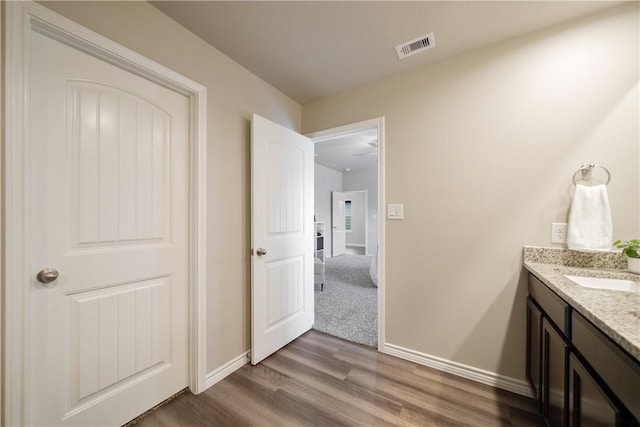 1142 Breebry Dr, Corpus Christi, TX 78415 - bathroom with wood finished floors and vanity
