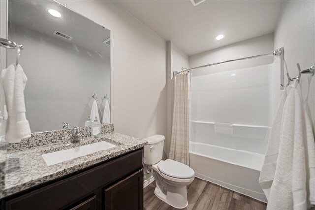 1142 Breebry Dr, Corpus Christi, TX 78415 - full bath with wood finished floors, shower / bathtub combination with curtain, and vanity