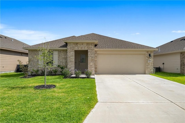 1142 Breebry Dr, Corpus Christi, TX 78415 - view of front of house featuring brick siding, an attached garage, concrete driveway, a front yard, and roof with shingles